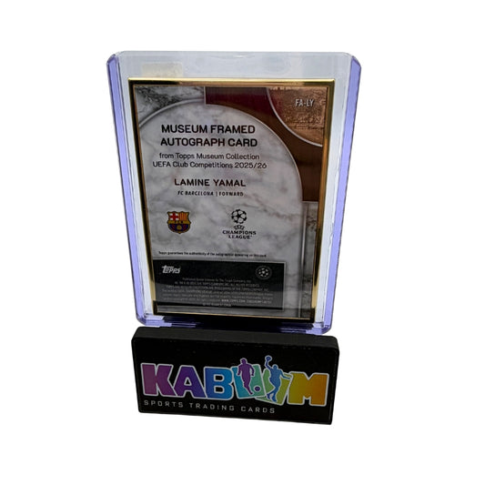 A framed autograph card display on a black base with colorful 'KABIDIM' branding. The central plaque reads 'Museum Framed Autograph Card' and includes Lamine Yamal FC Barcelona details, with a clear acrylic stand holding the card.