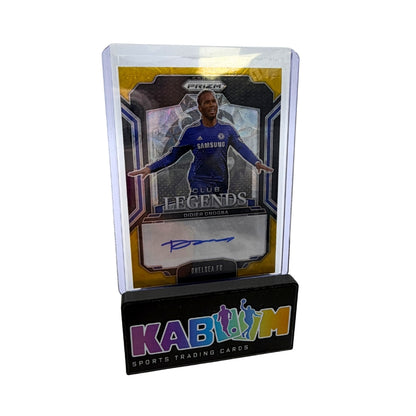 A collectible sports trading card in a clear acrylic display stand on a black base. The card features Chelsea soccer player Diego Chica, with a visible blue signature on a gold and silver design.