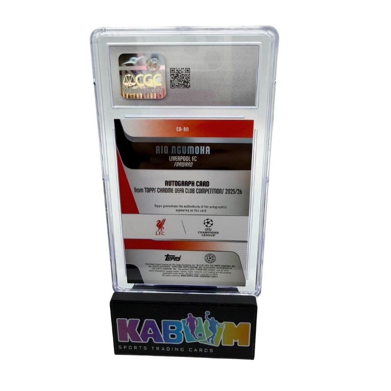 A collectible football (soccer) autograph card of Rio Akumuha from Liverpool FC, displayed inside a clear plastic grading case on a black stand branded with 'KABOOM SPORTS TRADING CARDS'.