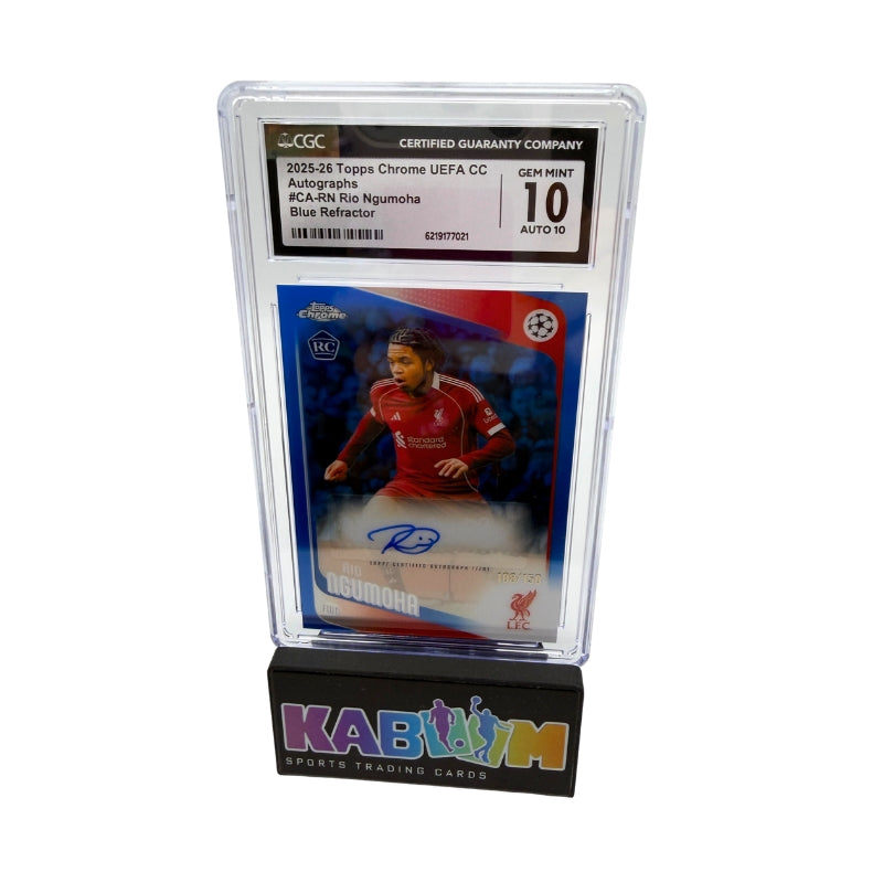 A graded Topps Chrome soccer card of Rio Ruidomuna, autographed and displayed in a clear plastic slab on a black stand with the KABOOM logo. The slab is graded and sealed by CGC.