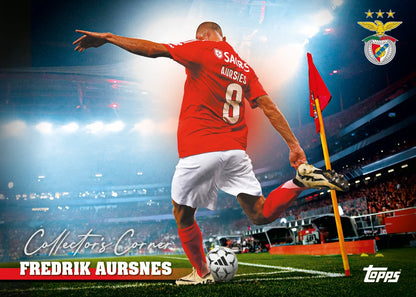 Soccer player in red jersey kicking a ball on a stadium field with visible branding and logos. Collectors corner, fredrik aursnes